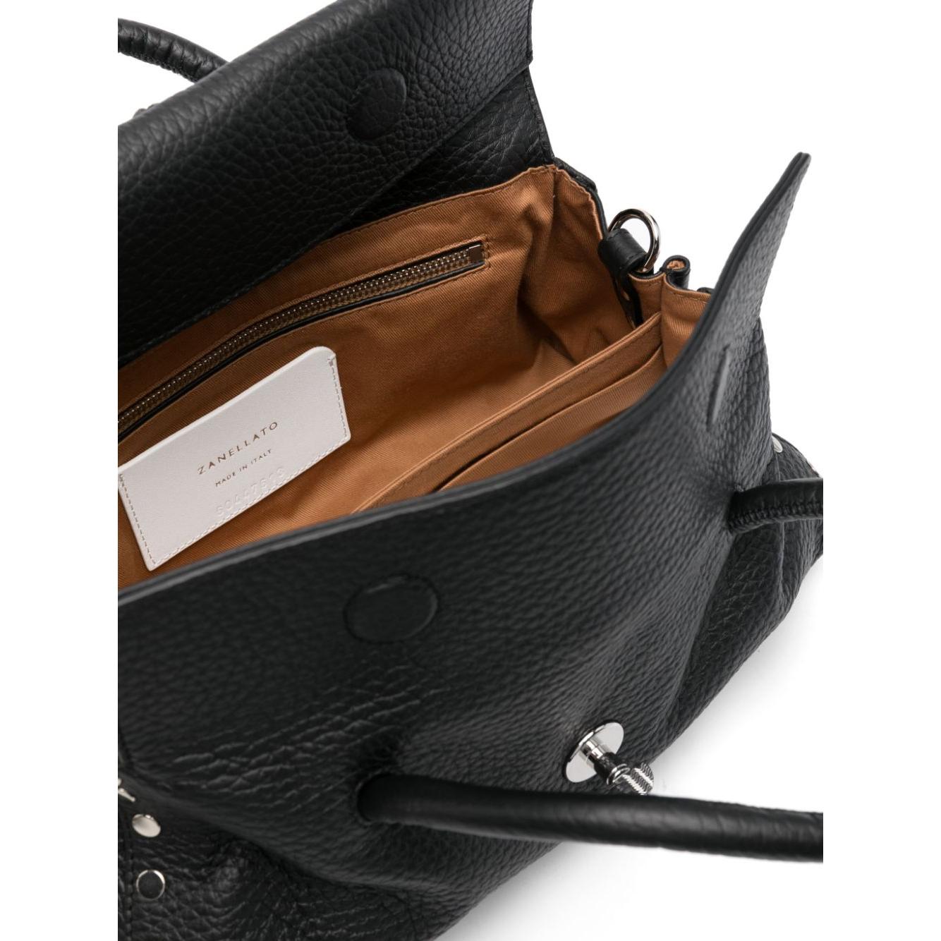 Front view with bag zipped and handles upright.